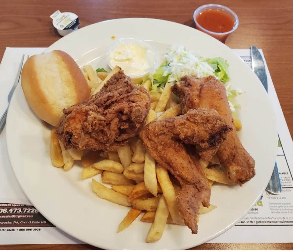 Bert's fried chicken with fries, coleslaw, and dipping sauce
